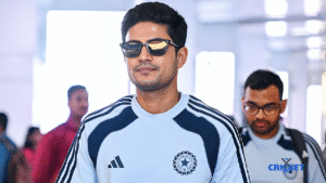 India cricket player in team jersey with sunglasses, arriving at the stadium.