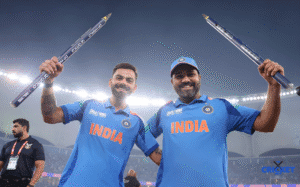 India cricket team celebrating after a match, holding bats and smiling.