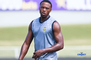 South African cricketer Kagiso Rabada in training, focusing on his athletic build and cricket gear.
