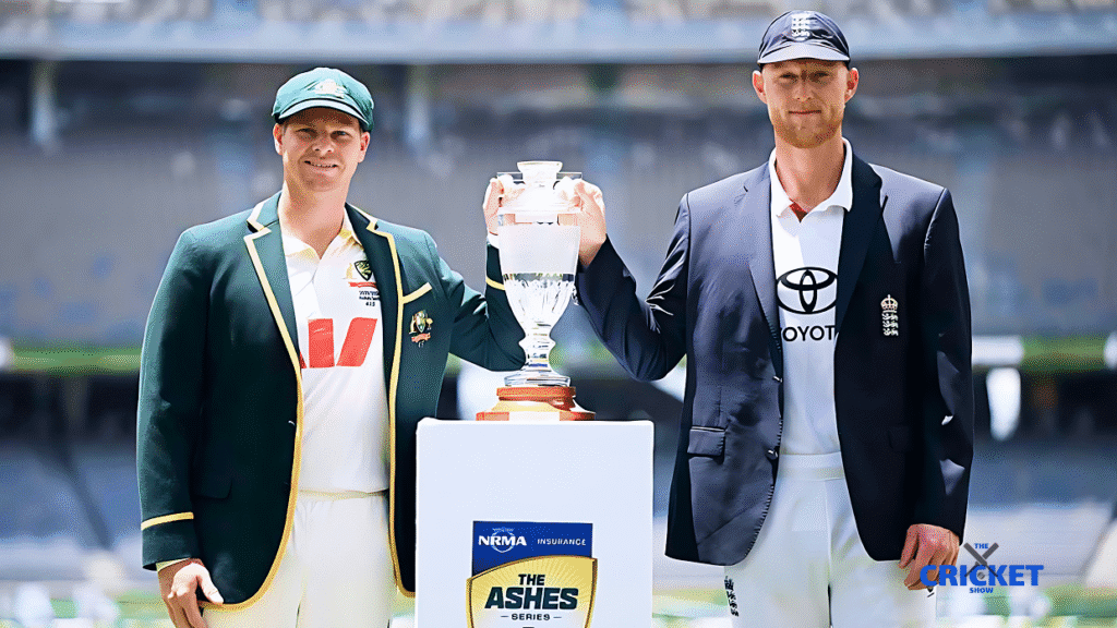 Two cricketers holding a trophy during The Ashes award ceremony at the stadium.