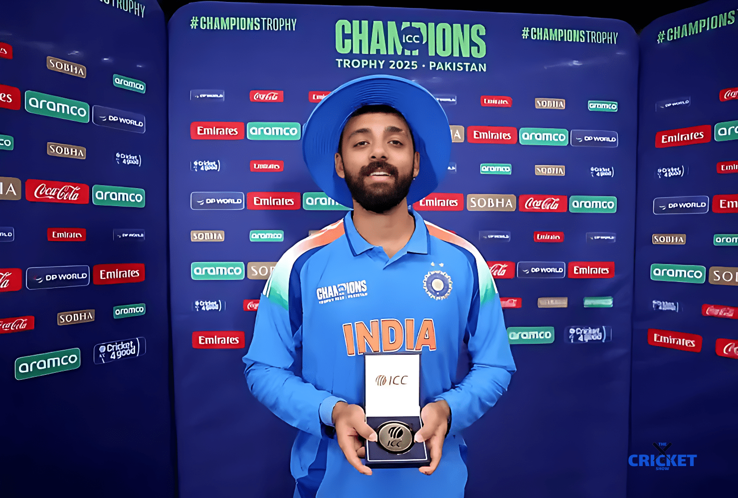 Varun Chakaravarthy holding ICC award after winning Champions Trophy 2025 in Pakistan.