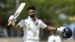 Ruturaj Gaikwad holding a cricket bat and helmet, celebrating his record-breaking achievement in Lis.