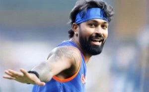 Hardik Pandya in action during a cricket match, celebrating a milestone.