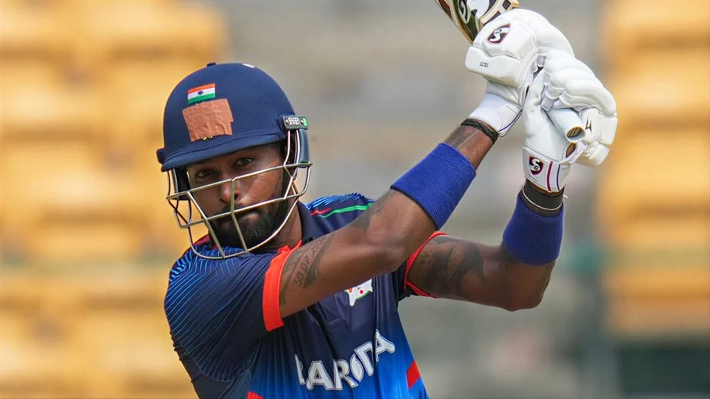 Hardik Pandya Smashes Maiden List A Century as Baroda Post 293 vs Vidarbha Hardik Pandya plays a powerful shot during a cricket match for India.