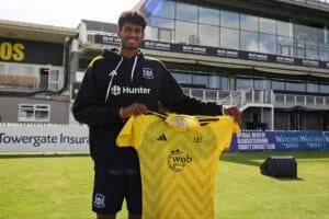 Aman Rao holding Hyderabad cricket team jersey during Vijay Hazare Trophy 2025.