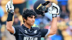 Cricket player holding helmet and bat after a match, celebrating a win.